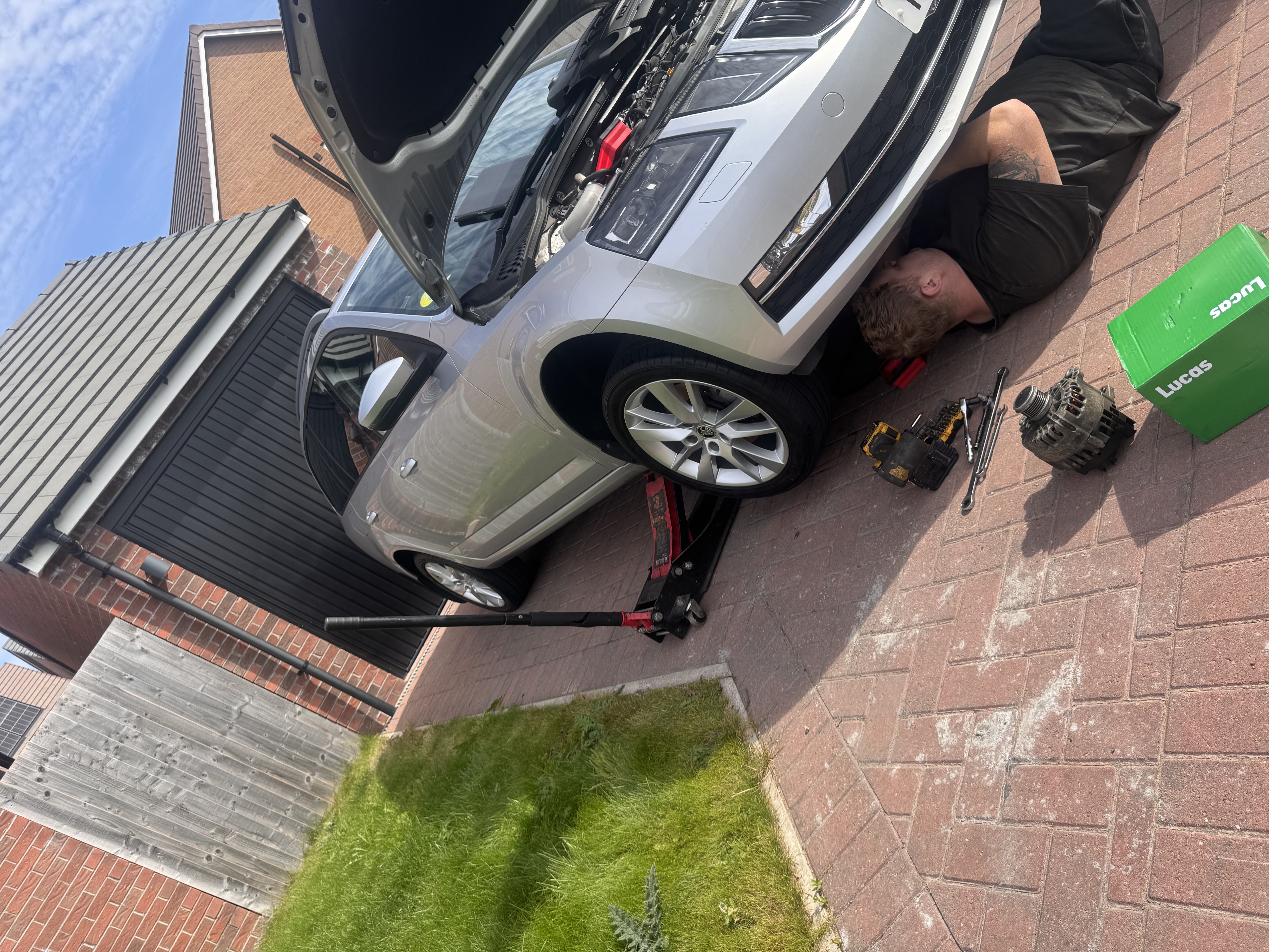 Alternator being replaced at customer's home — mobile mechanic Up Holland